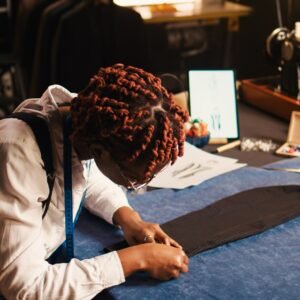 African american tailor preparing fabric