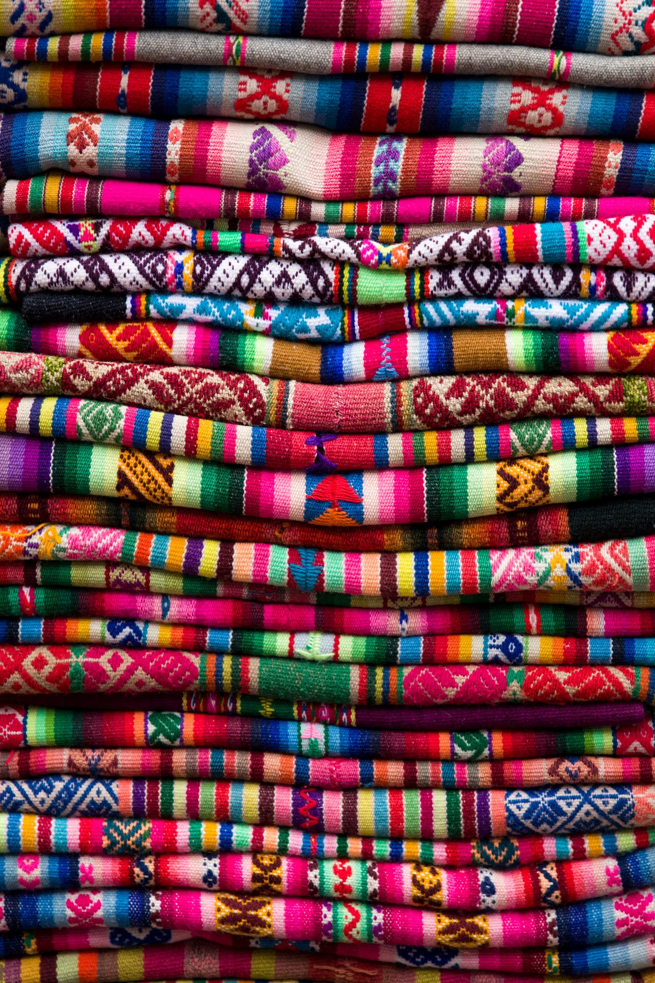 Colorful traditional peruvian fabrics on the market
