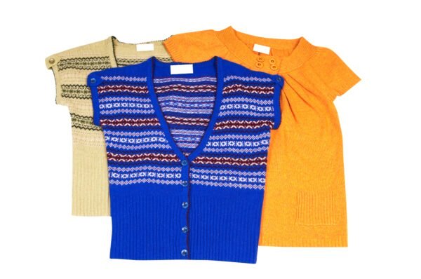 Modern warm waistcoats and tunic on a white.