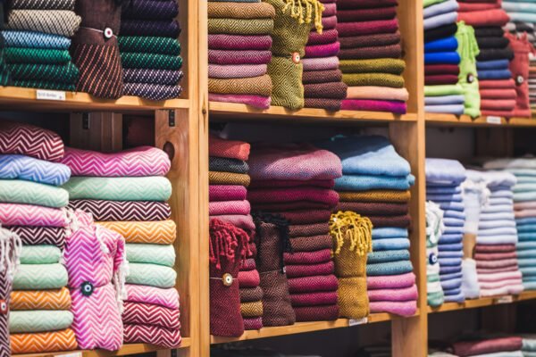 Store tissue. Big shelf with a colorful towels